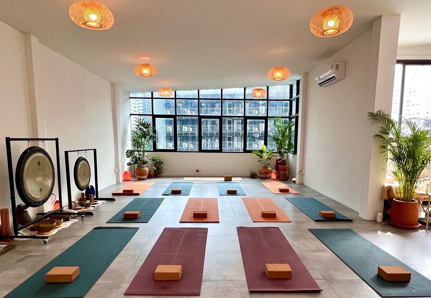 Serene yoga studio with mats and natural lighting